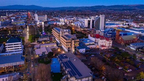 Aerial view of Palmerston North City Centre with the mountains as background.