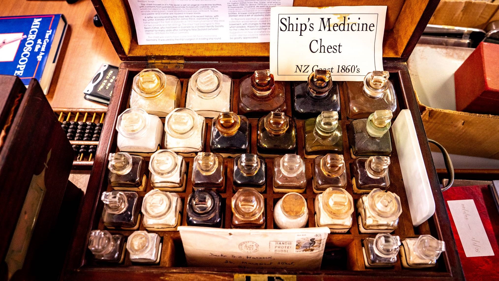 A wooden medicine chest complete with medicine bottles, recovered from a shipwreck on the New Zealand coast in the 1860s.