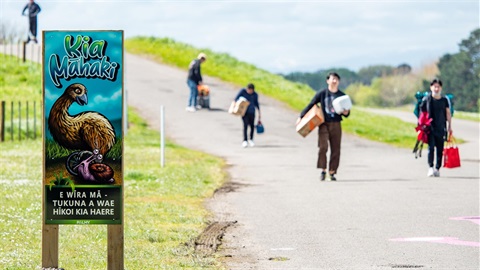 Image shows people walking along the Manawatū River shared pathway.