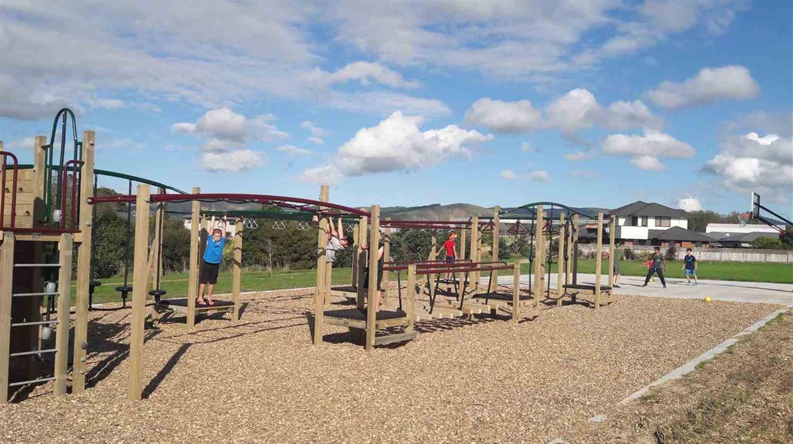 Photo shows kids on the climbing equipment at the adventure playground.