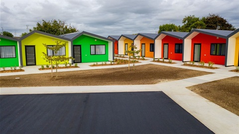 The new homes at Papaioea Place are painted in cheerful colours.