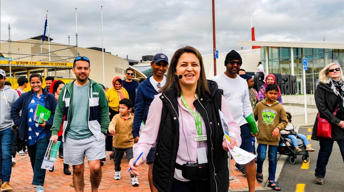 Our welcoming communities coordinator leads a large group of Palmy newcomers of all ages on a walking tour of the central city.