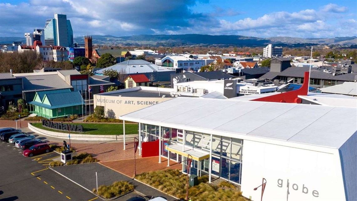 Aerial view of Palmy's community theatre with the city in the background.