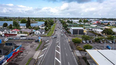 Aerial image shows the cross of two major roads with vehicles travelling.