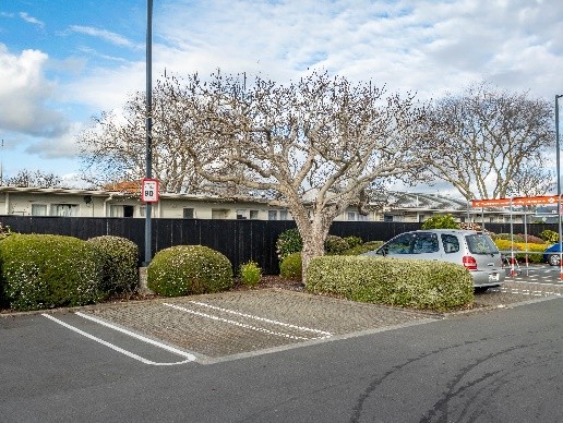 image shows car parks outside a shopping area