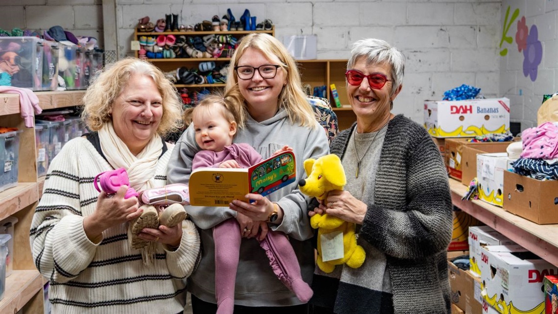 Trina Sheridan with her mokopuna, daughter and co-organiser Lara and one of their awesome volunteers.