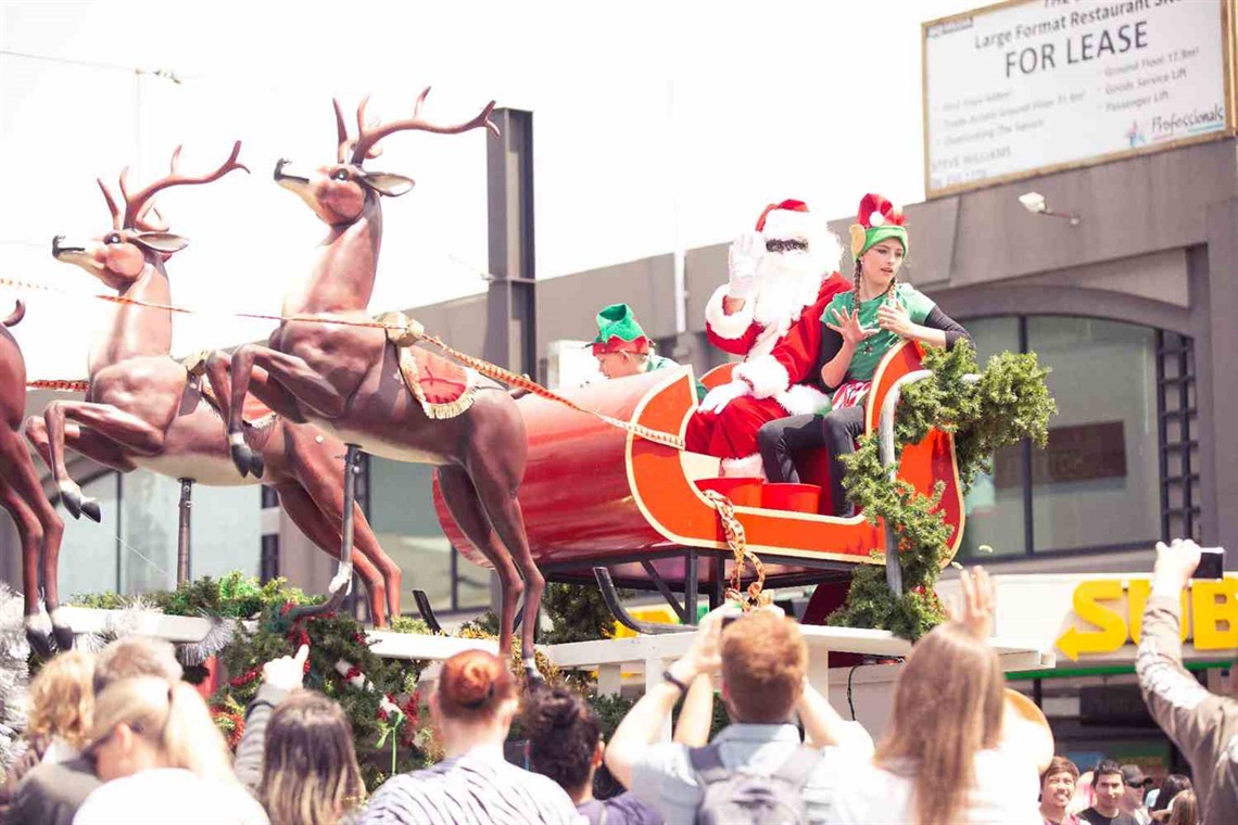 Photo shows a sleigh float carrying the Santa at a parade