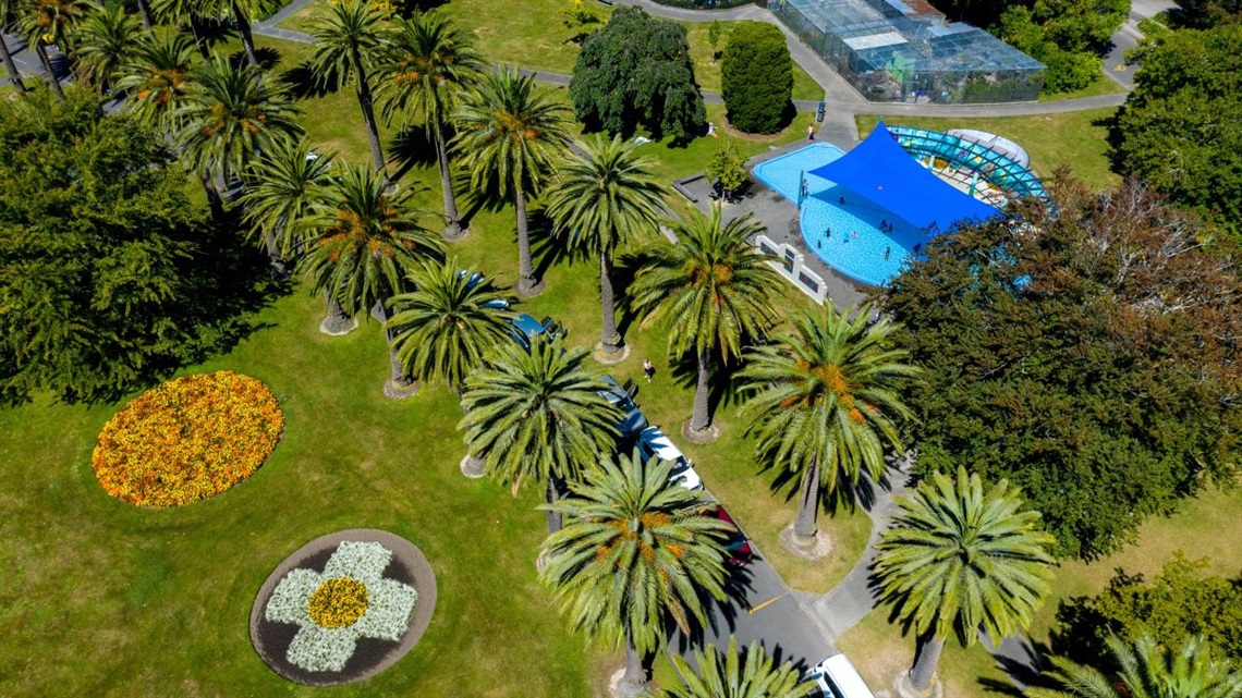 The central gardens at the Esplanade shot from the air, showing the paddling pool and aviaries near the avenue of palm trees.