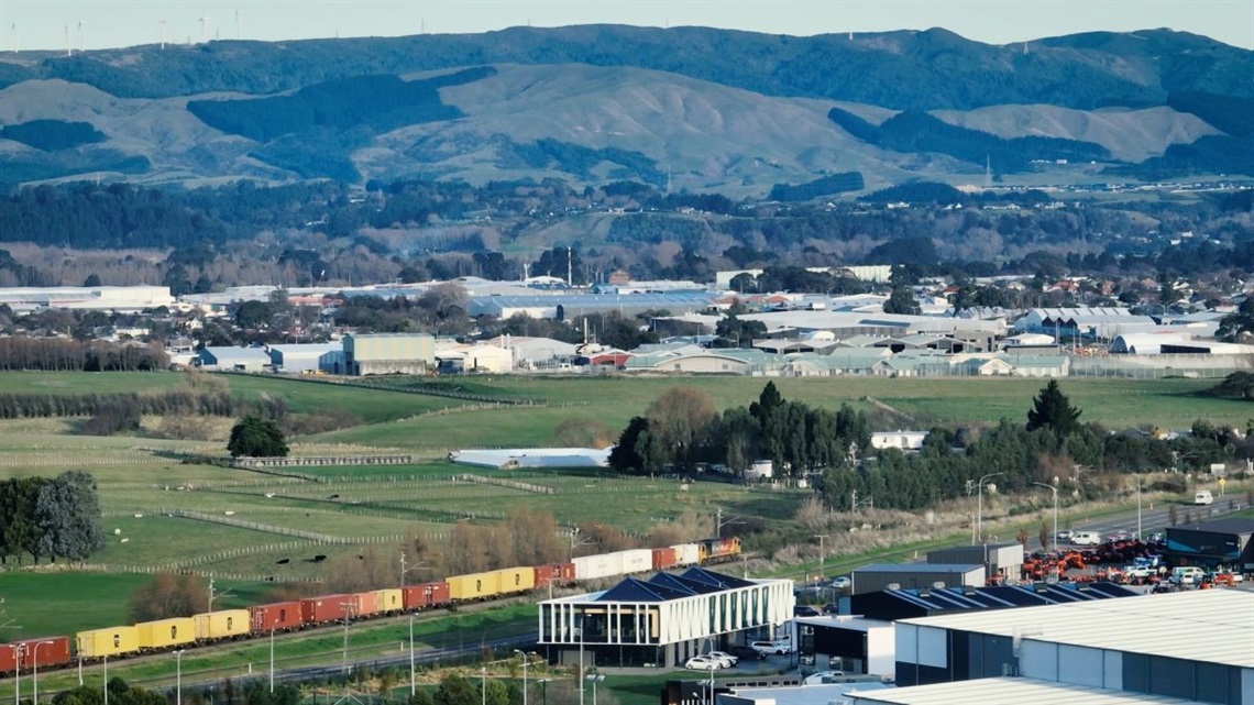 A freight train rolls through land newly designated for KiwiRail's intermodal freight hub.
