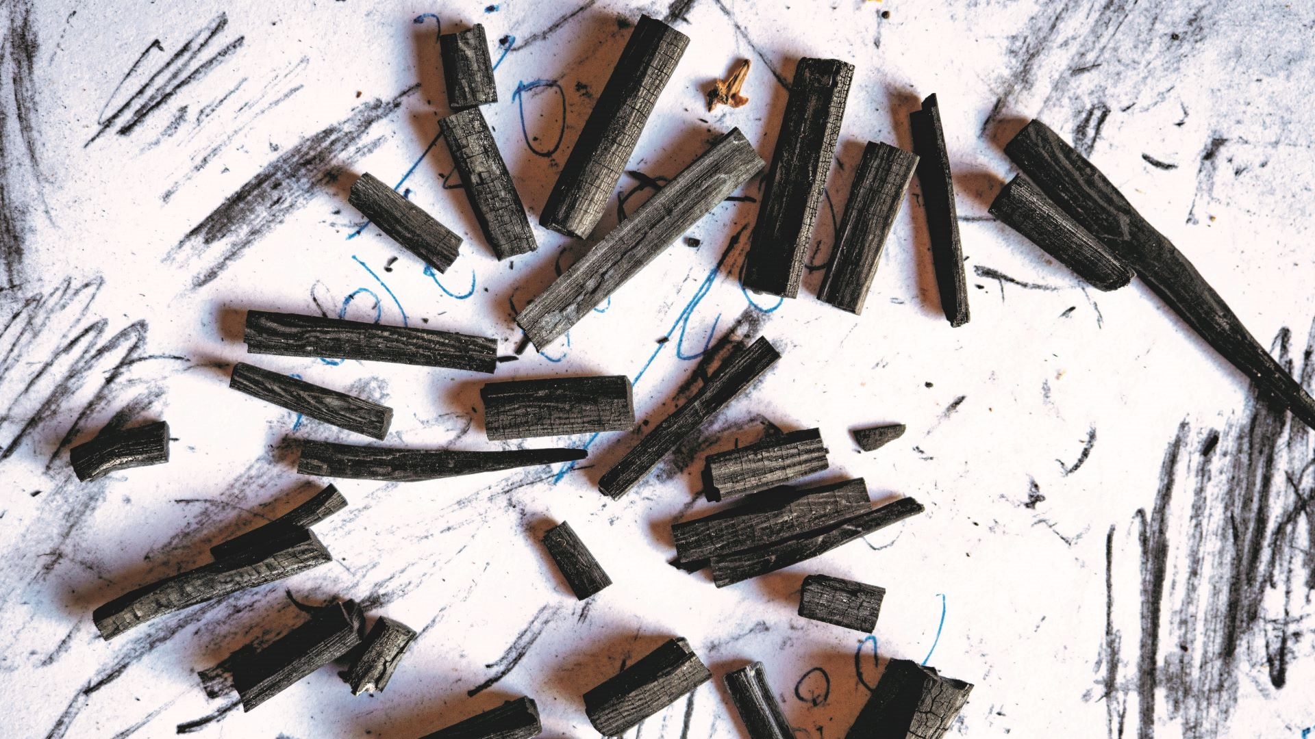 The charred sticks of tōtara that are Tsutsumi's preferred tool.