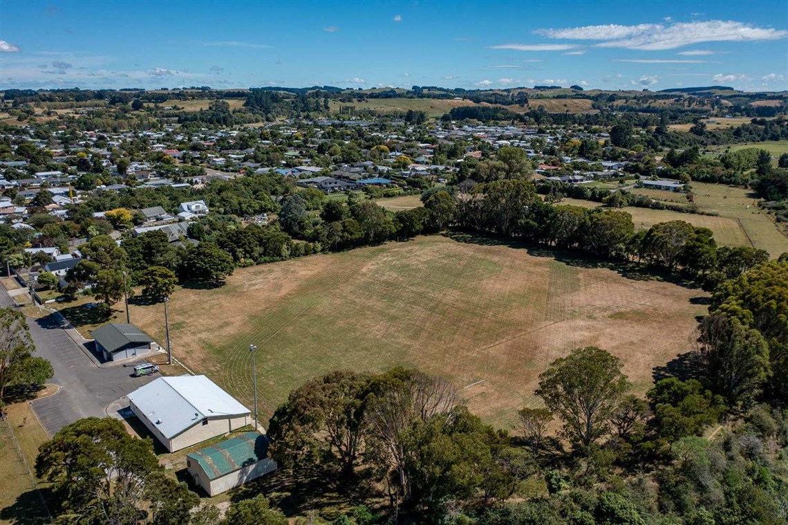 Image shows aerial view of a large grass land.  