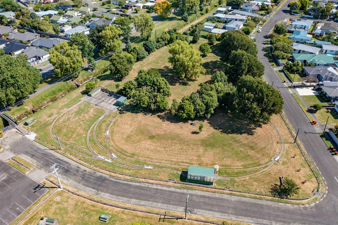 Image shows aerial view of a reserve with some miniature train trucks.