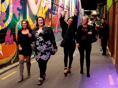 A group of people party at a silent disco in Berrymans Lane.
