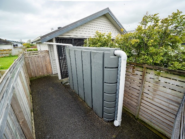 image shows a water tank by a residential property