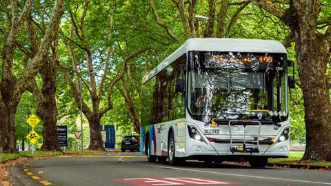 Image shows an electric bus travelling on road