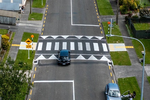 Image shows aerial view of a raised pedestrian crossing on an empty road