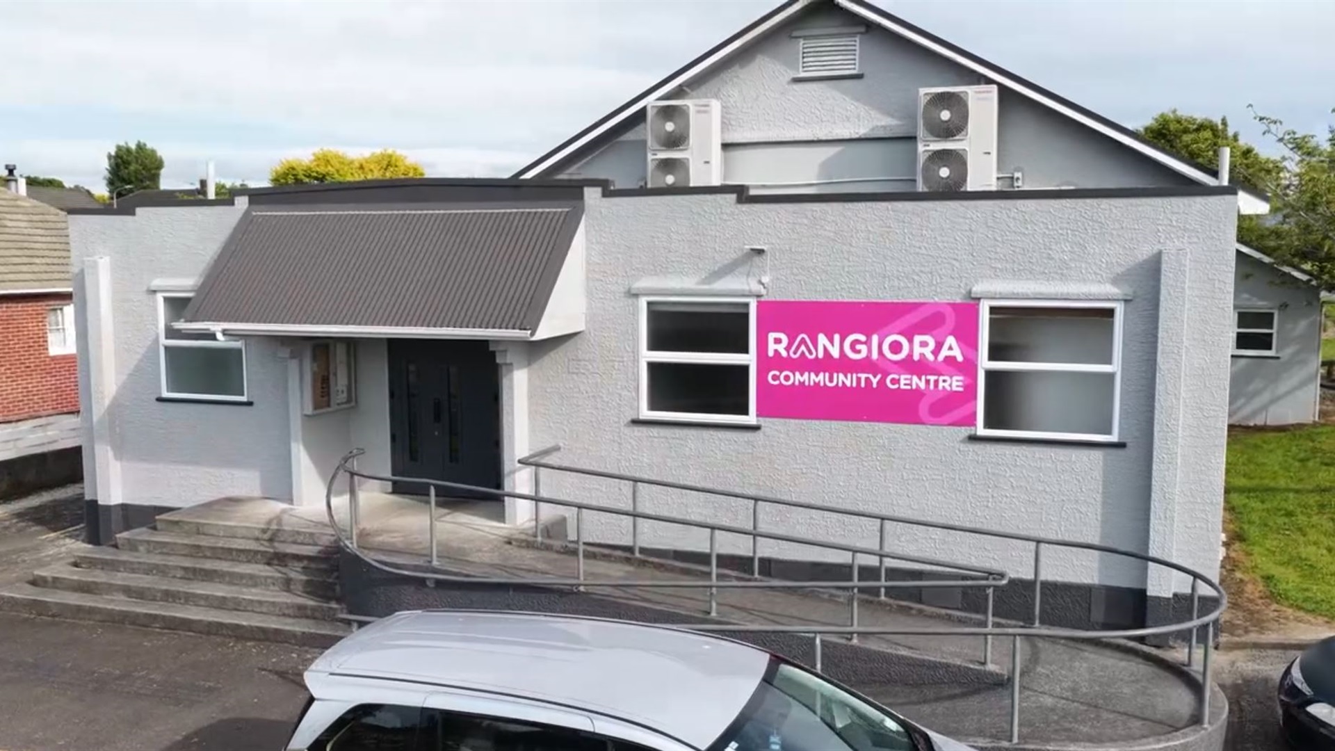 A typical 1950s public hall, built from stucco with a ramp up to the front doors.