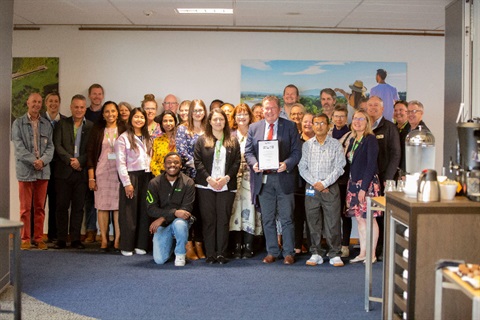 Group photo shows people celebrating Palmerston north being recognised as one of New Zealand's most welcoming communities