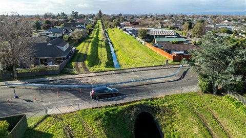 A small road bridge crosses a culvert.