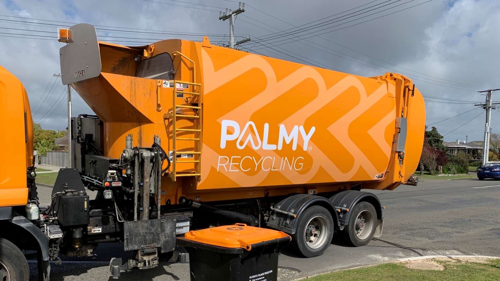 New-look recycling truck, coloured orange to match the orange-lid wheelie bins.