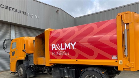 Rubbish truck with new-look branding and lettering that says Palmy Rubbish.