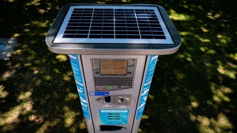 Photo shows closeup of parking meter.